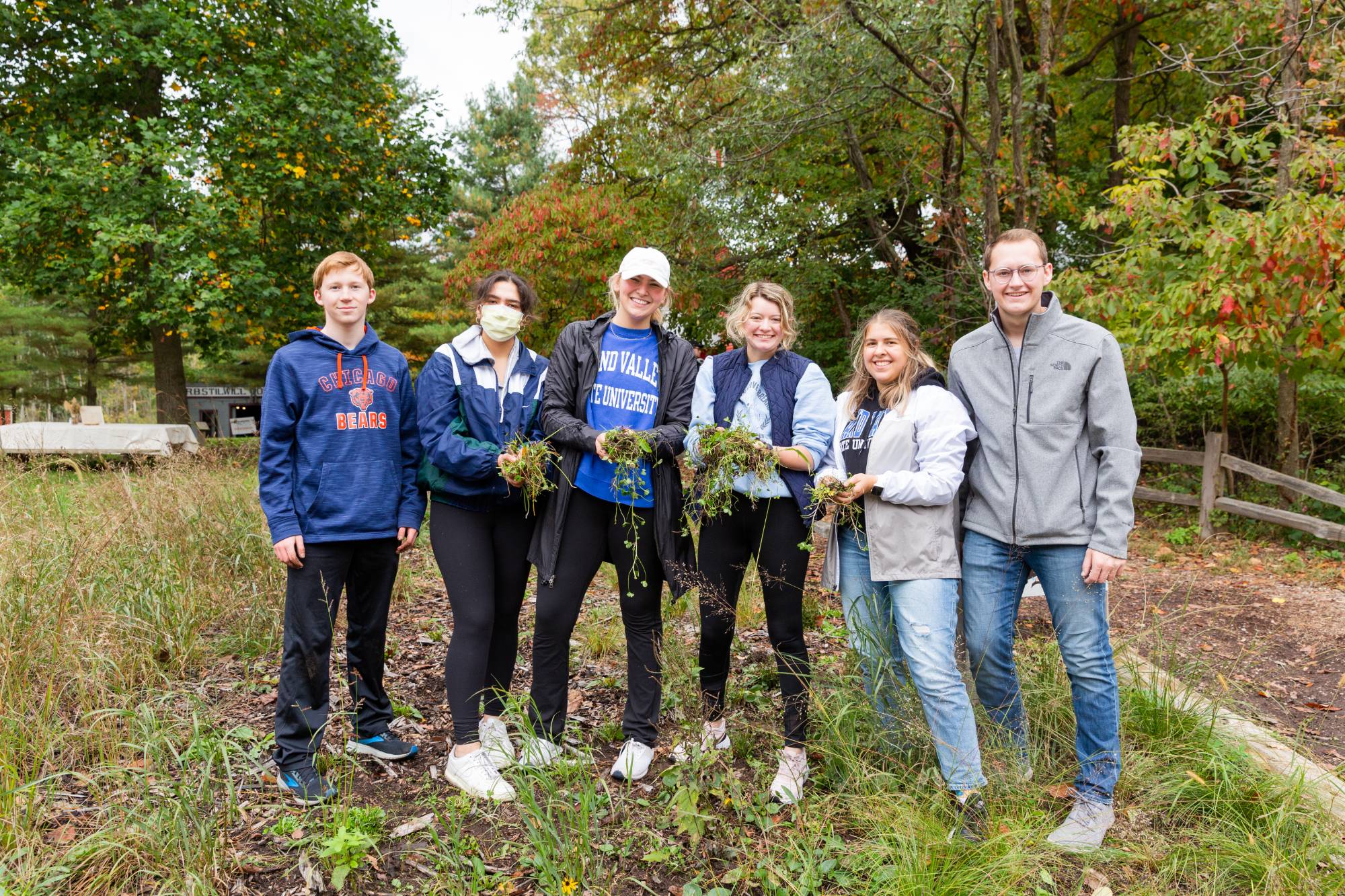 Students standing in a garden